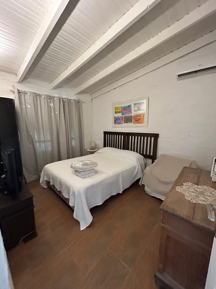 Master bedroom with 2-seater bed frame.  