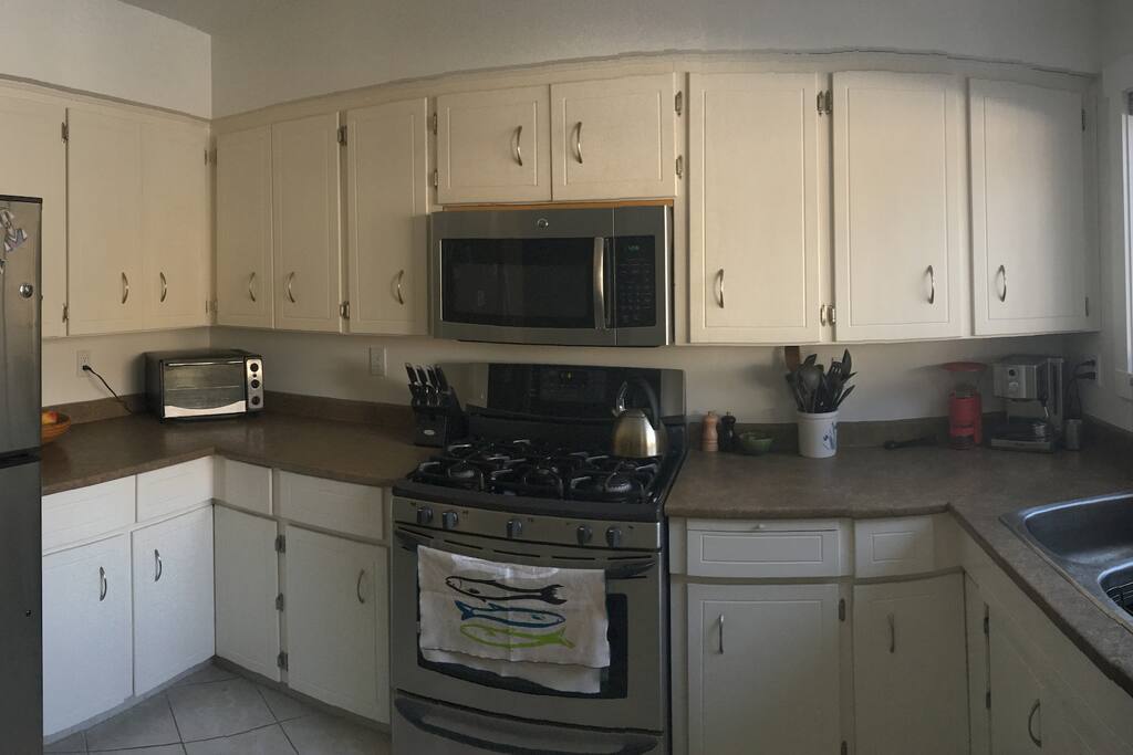 Enjoy cooking some meals in a fully equipped kitchen including a gas range, espresso machine, and dishwasher.