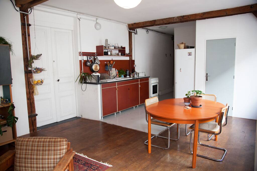 Big living room with open kitchen and dining table