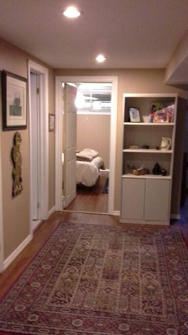View of the entryway, bathroom is the door on the left and the bedroom is straight ahead