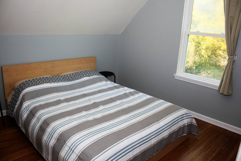 Queen bed and full closet in bedroom.