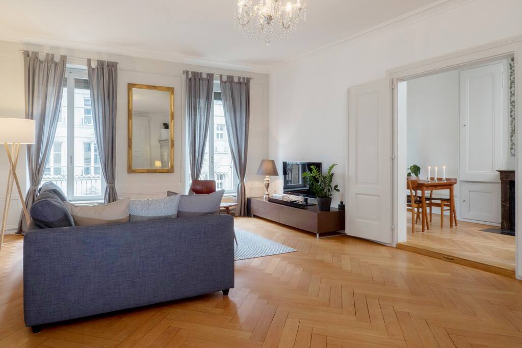 Living room and dining area with beautiful parquet flooring