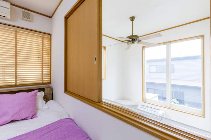 The window in the second bedroom overlooks the living room.