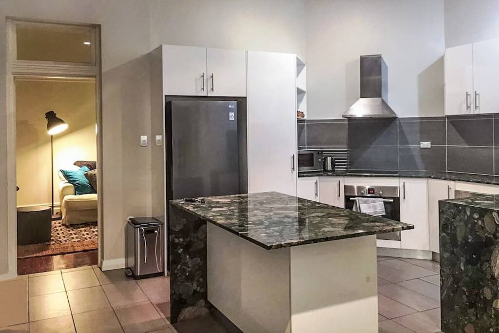 Spacious modern kitchen with quality stone tops.