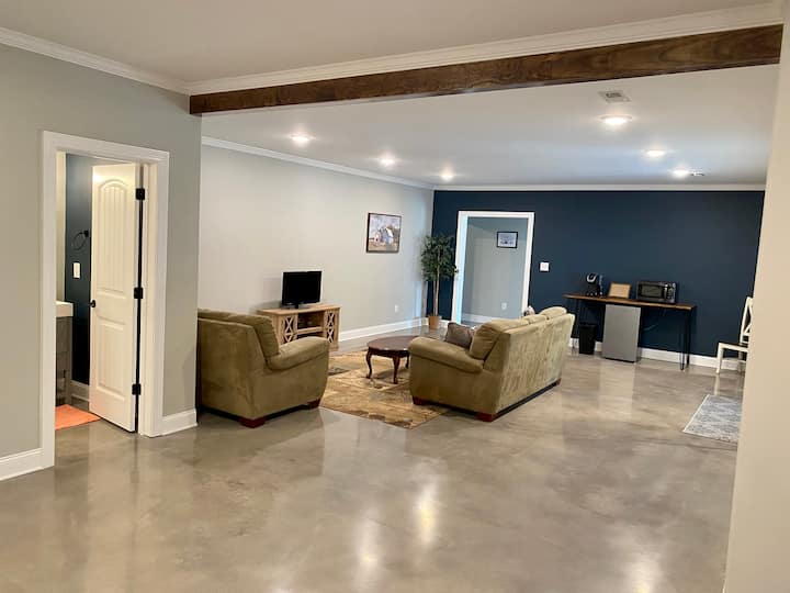 Main living area with comfy couches and TV 