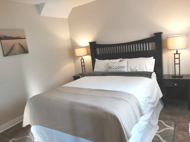 Main floor private bedroom with brand new hotel style mattress