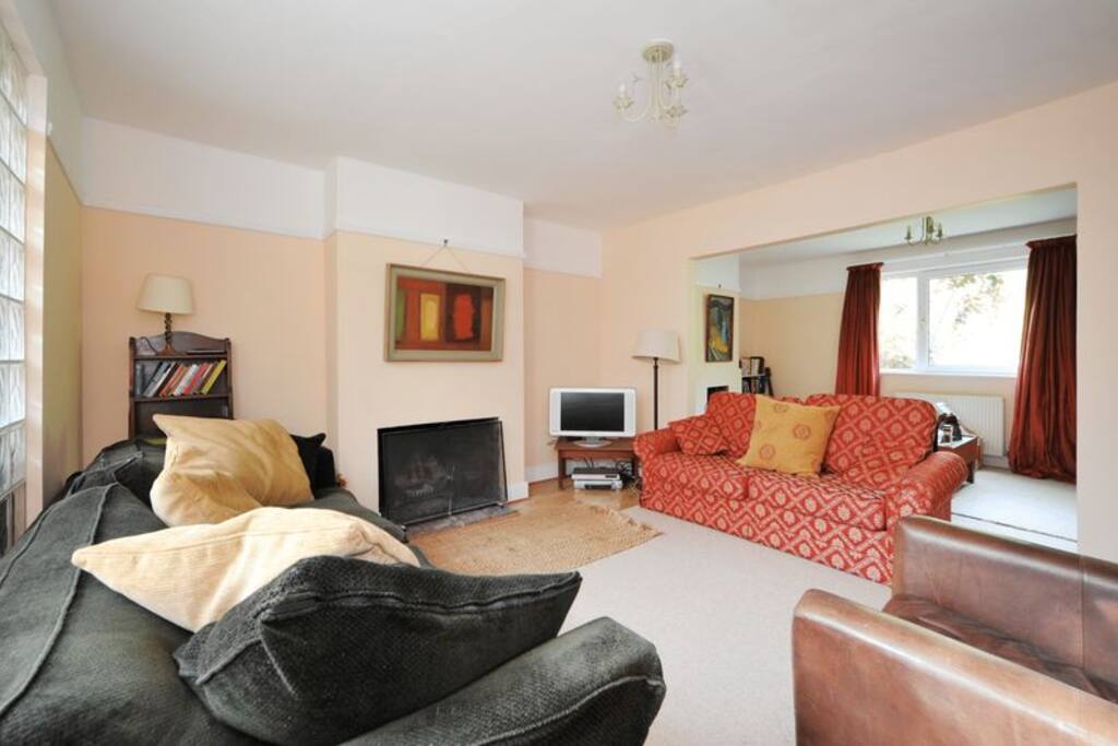 Cosy sitting room with real log fire