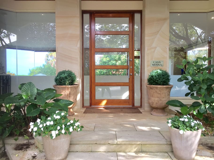 An Entrance that welcomes you inside our light filled home .