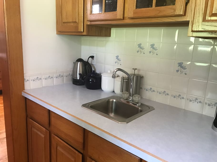 There is a "Butlers Pantry" between the kitchen and the dinning room. We keep this stocked with lots of teas and Keurig coffee pots for our guests to use as they please.