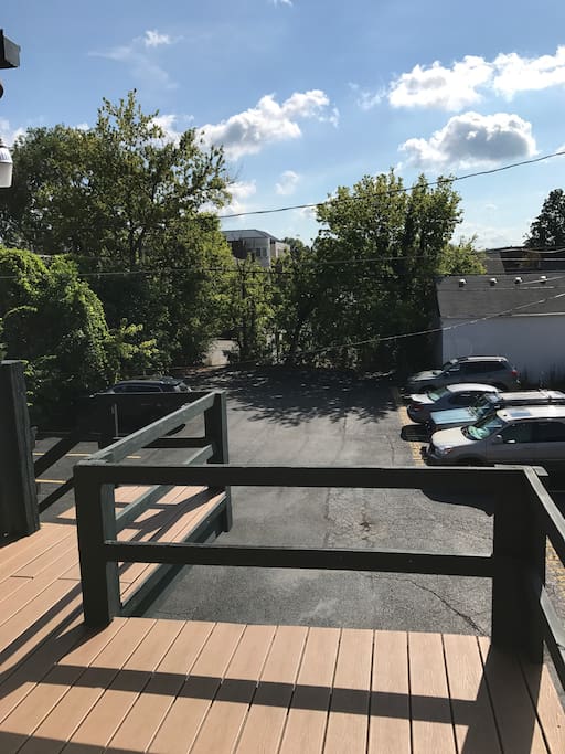 Balcony off of kitchen for sitting and enjoying the day or night! Parking is back here too if you have a car.