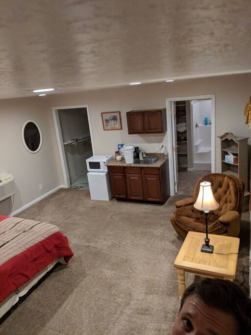 microwave, mini fridge, small sink and closet