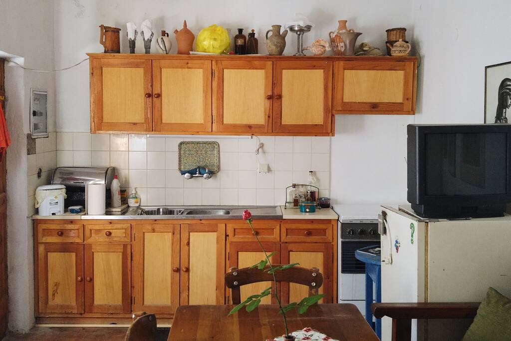 The kitchen and common place with the fireplace