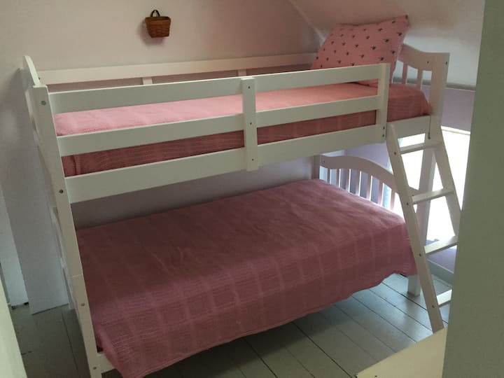 Middle/train bedroom with twin bunk bed. Lower bed has limited headroom (the unavoidable part about bunk beds). 165 lb. weight limit.