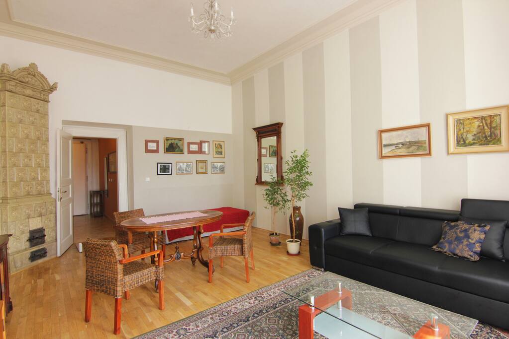 Living room with dining area and antique tile stove