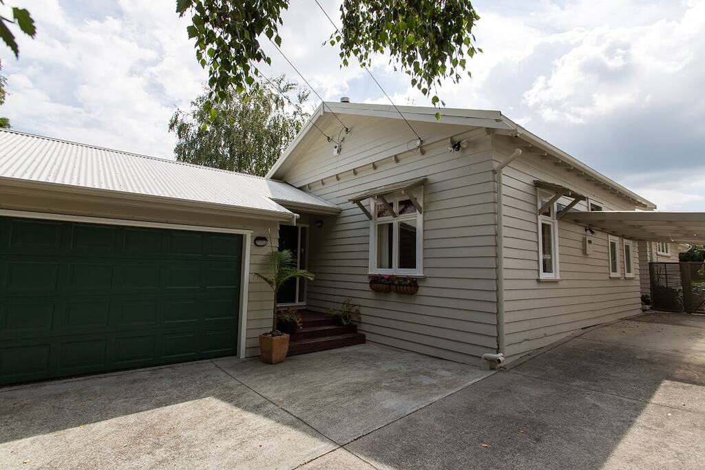 Photo taken from street face with double garage on the left and covered front entry