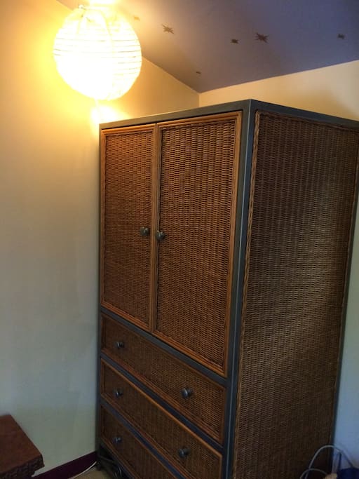 Wardrobe includes 3 drawers and a clothes rack for hanging clothes.
