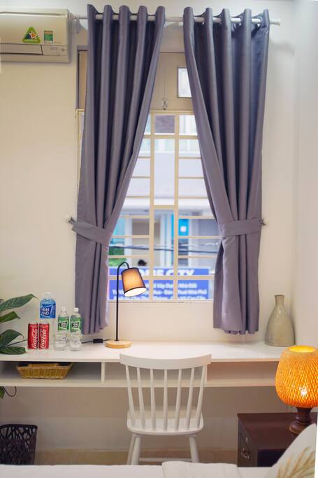 Room with window looks out the road