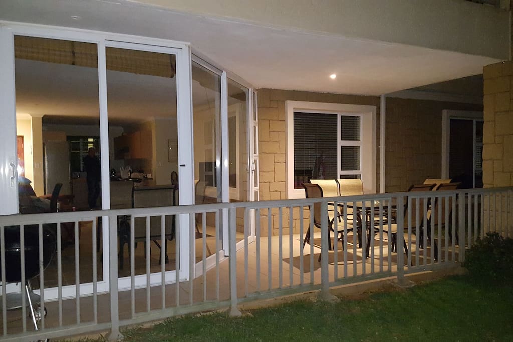 Front of house showing the outside patio and braai area.