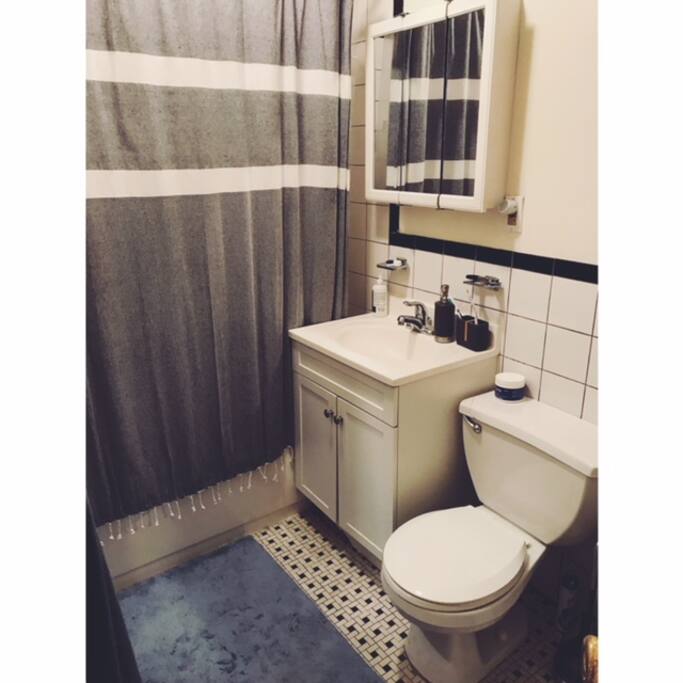 Bathroom with spacious vanity, bathtub and shower.
