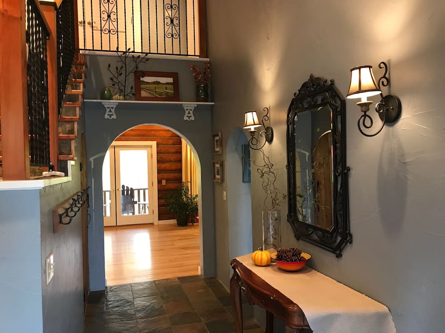 The two-story foyer opens into the open floor plan.
