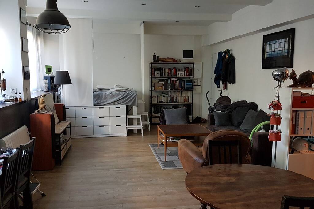 Main room with a double bed and a folding sofa