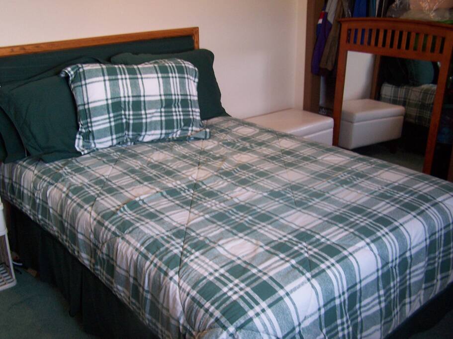 Guest bedroom with double bed, white box on right is open storage for your use.
