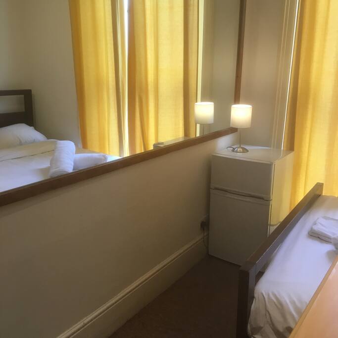 (A Brand New double-door, mini fridge-freezer added to the Room recently)