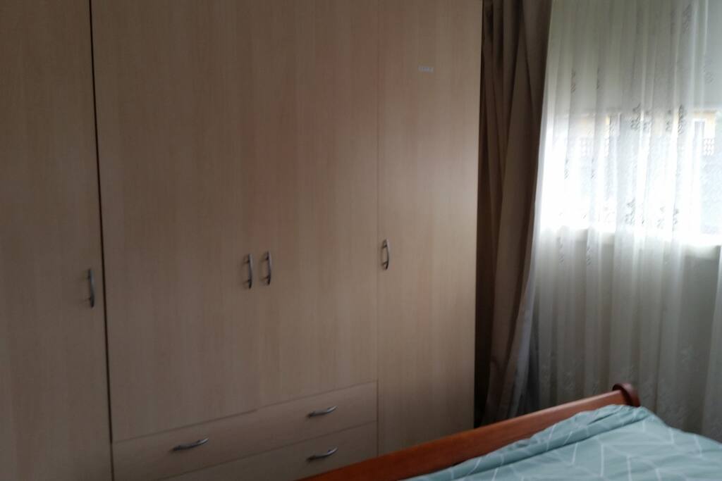 Plenty of hanging space for that longer stay. Iron & ironing board