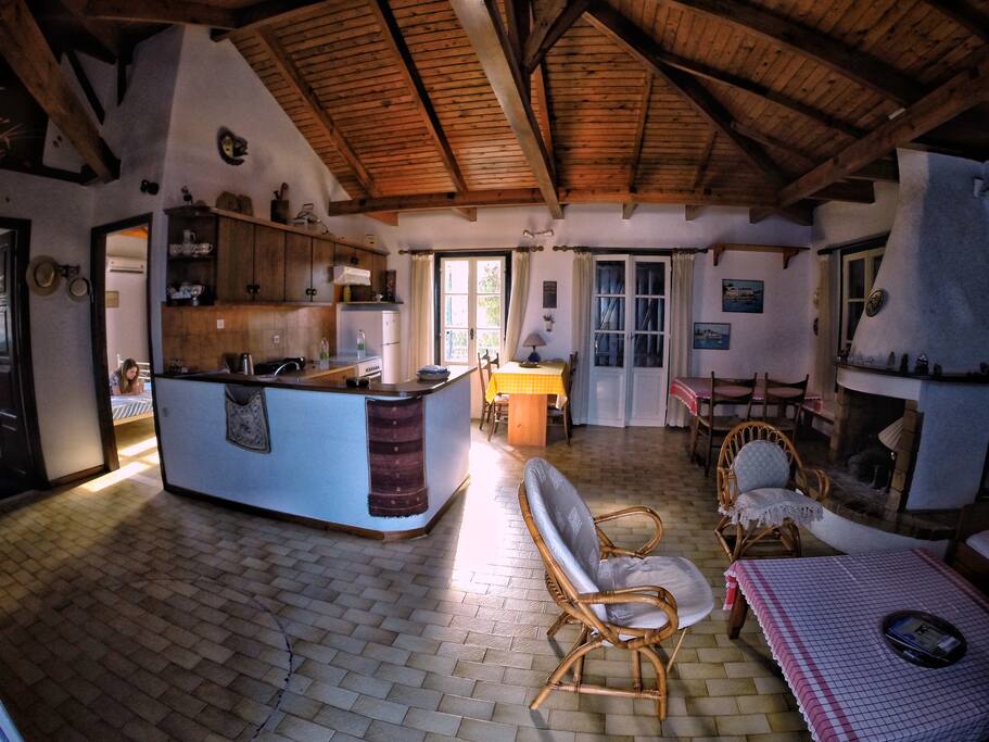 Our top floor. As you enter, you will see the wooden ceiling - to the right we have the living room, further in you can find a dining table and to the left, the kitchen and the two bedrooms.