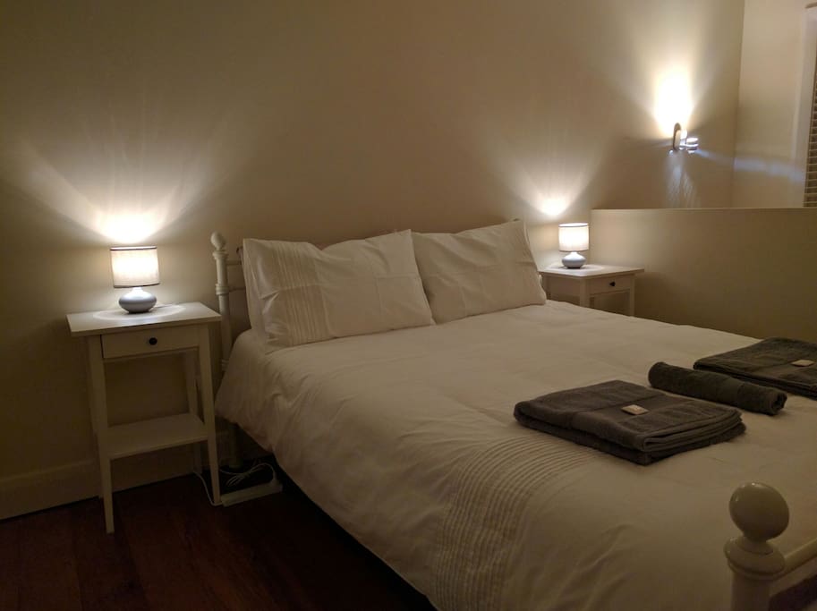 The Queen bed in the main bedroom