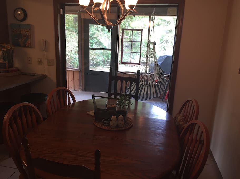 The breakfast table seats 6 plus bar seats 3, screened in patio adds more seating.