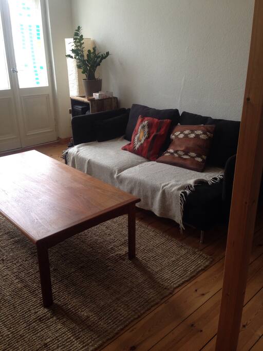 The chillout area, comfy couch, big windows, another balcony!