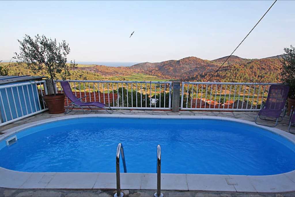 Pool with the view of the village and Adriatic Sea.