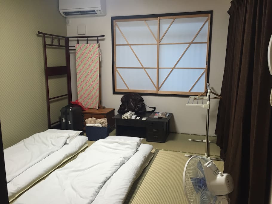 Futon-bed, spread on Tatami mat.