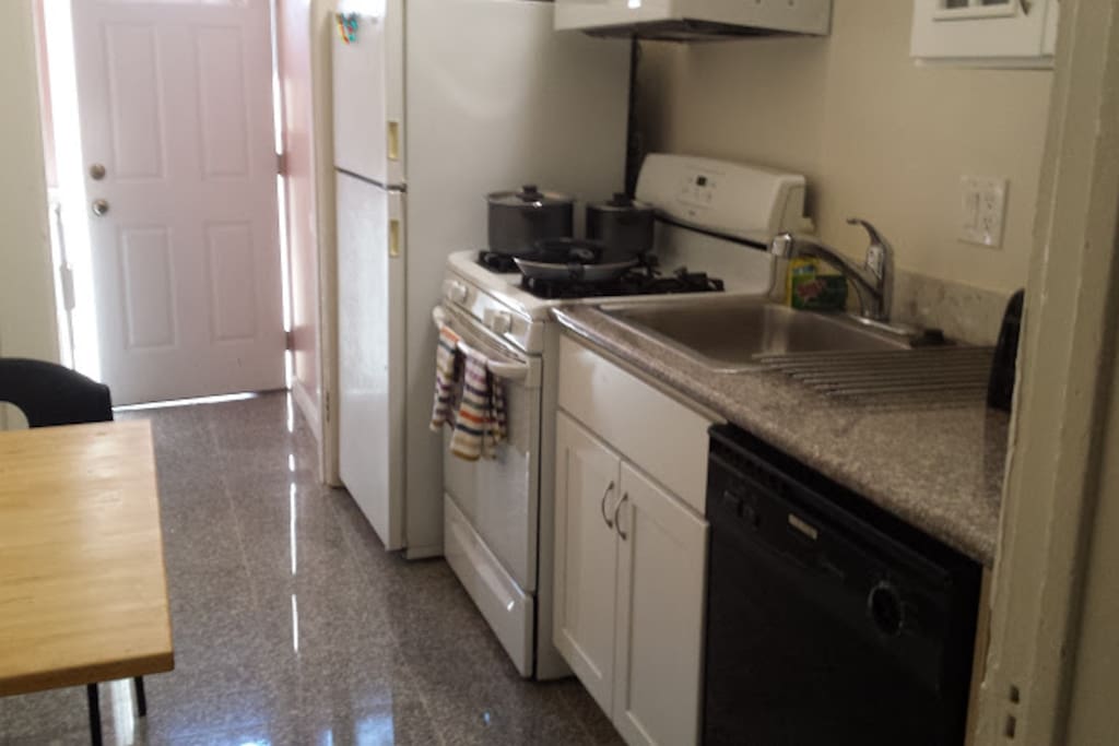 Kitchen with gas stove, dishwasher, and full size fridge