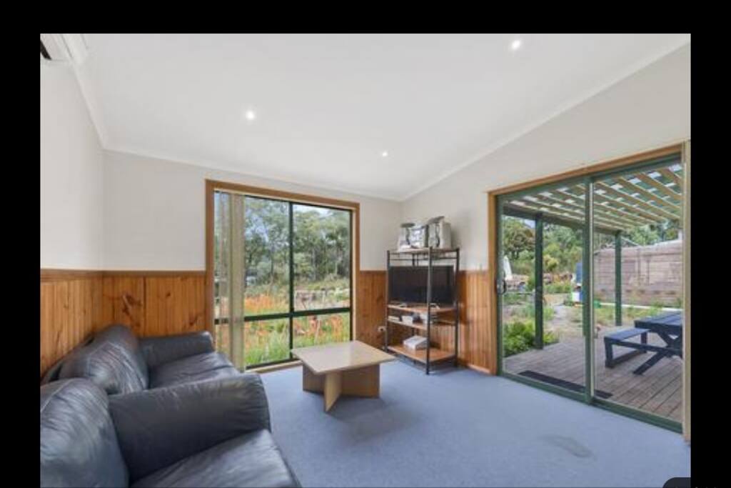 Lounge room with sliding door to deck