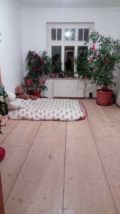 room 1 is connected to a little workshop with a sofa , and bureau and chair.
