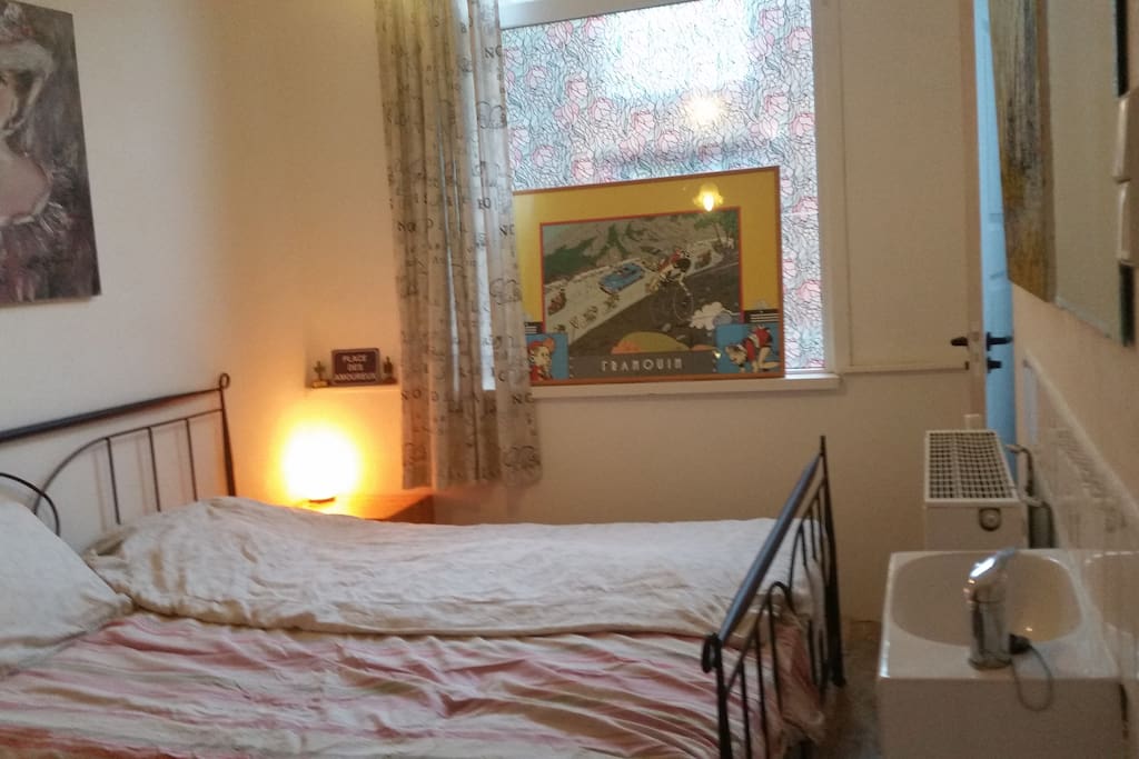 Quietly at the back of the house. Direct access (closable door) to the bathroom, own hot and cold water