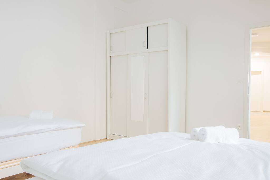 The bedroom with two beds that can be put together