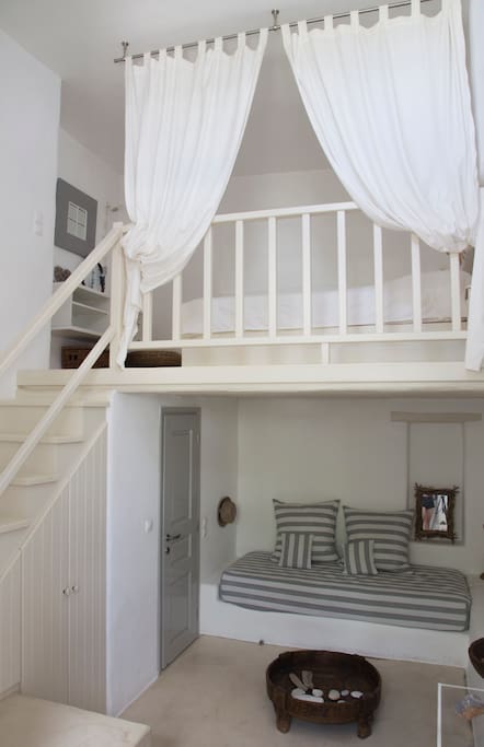The main room, with a double bed on the upper floor and a single on the lower