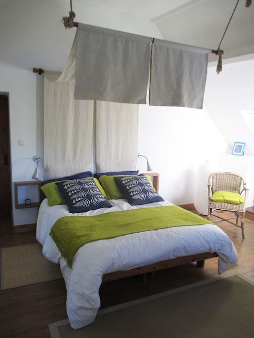 first bedroom with double bed and toilet/basin cabinet