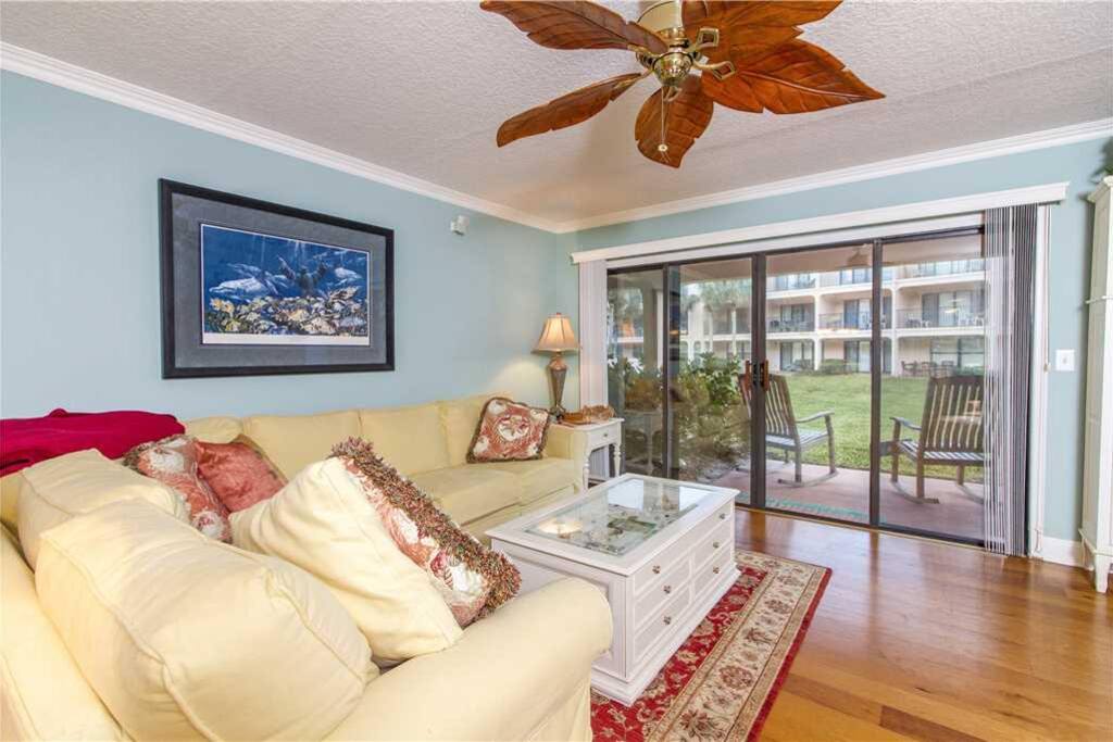 Easy Access - The living room provides quick and easy access to the patio where you can sit and enjoy the cool breeze and share s