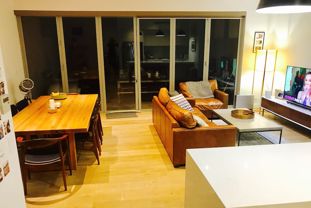 Open plan lounge leading to outside entertainment area retractable doors