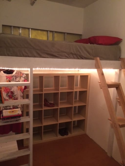 Full-size lofted bed.
