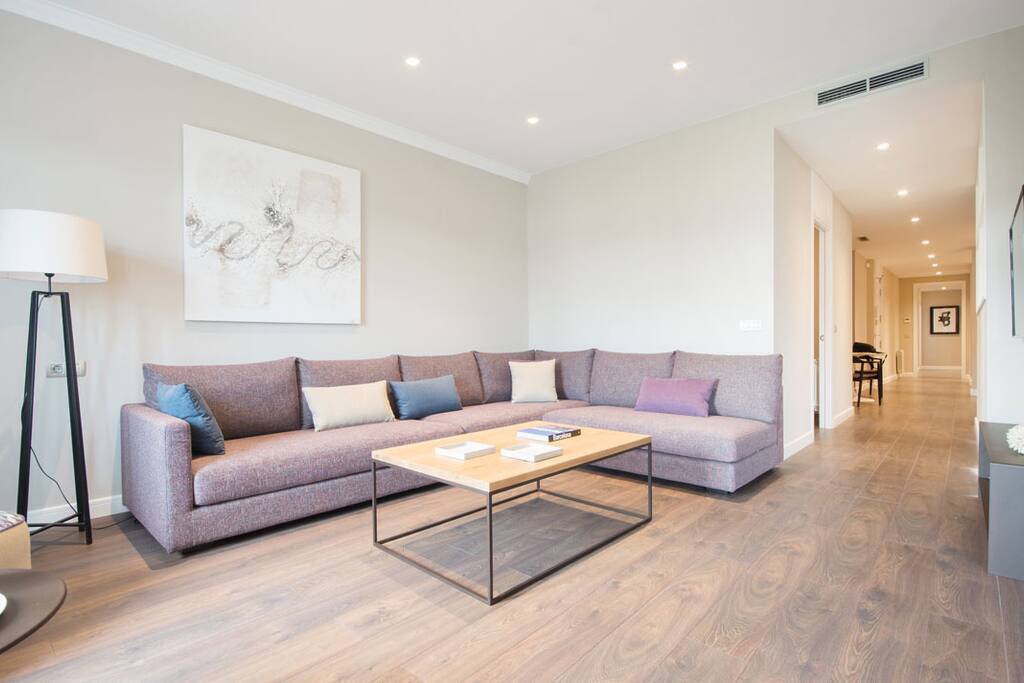 Hugh spacious living room with great views to Passeig de Gracia Boulevard.