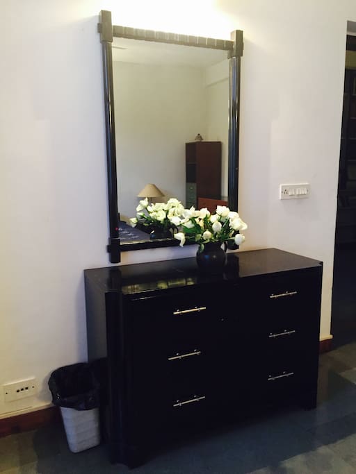 This is the dresser in the room for you to store your things while you are visiting with us. We try to make sure there are fresh flowers or the gardens in the house always have flowers on the bushes.