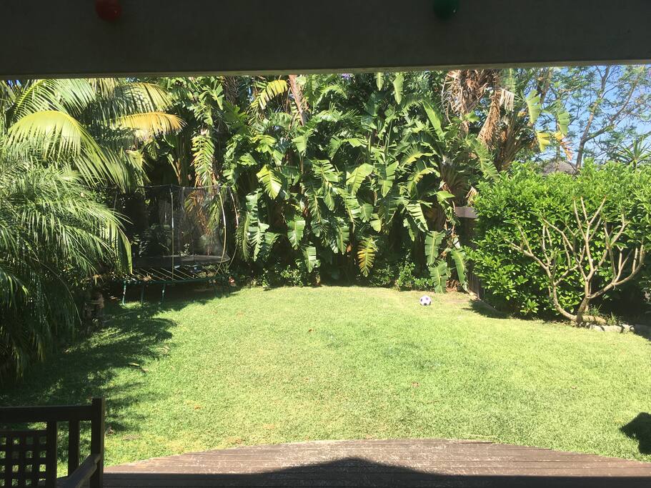 Rear garden with deck, lawn and bbq