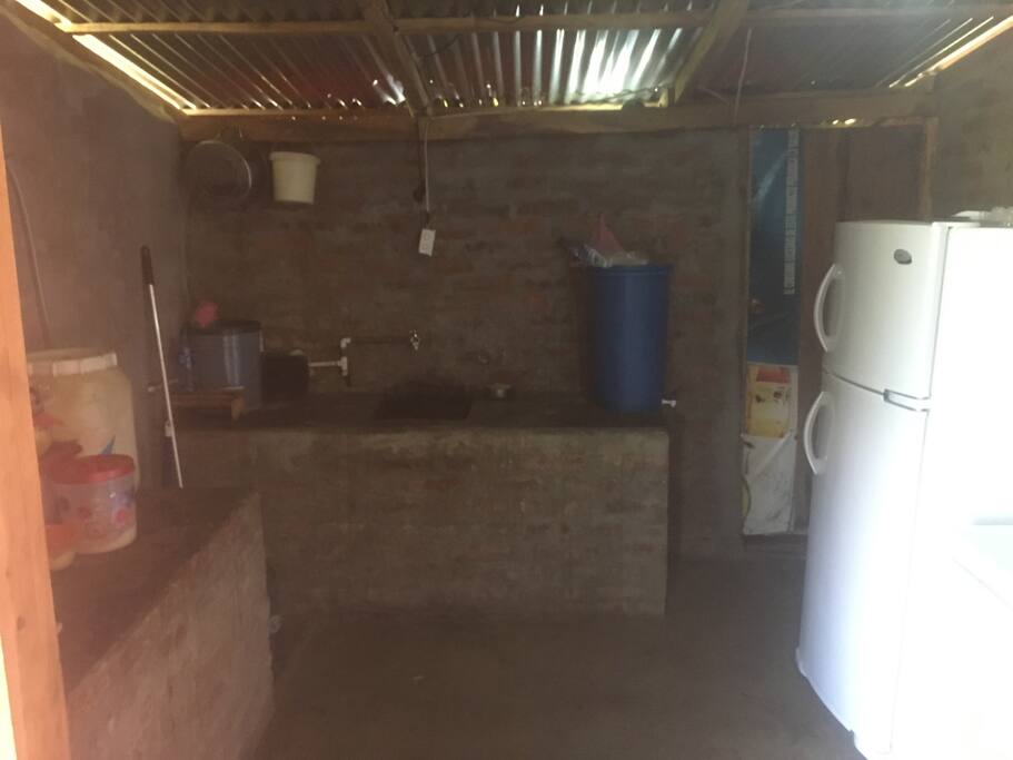 Fully equipped kitchen with a big fridge and fresh water