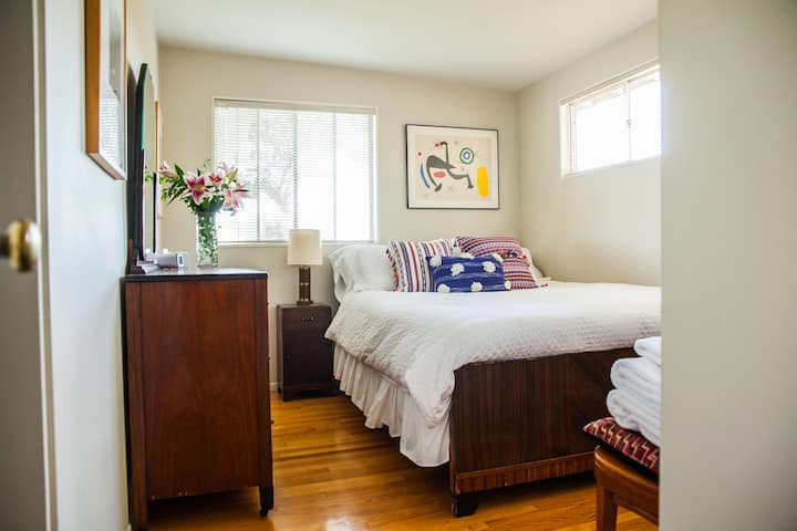 Bedroom with queen bed, 2 dressers and full closet.