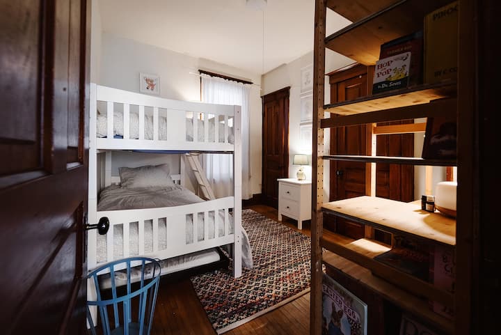 There are a total of three beds; the two bunks, and a trundle underneath that easily rolls out. 